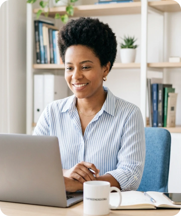 Woman smiling during a training video call on her laptop